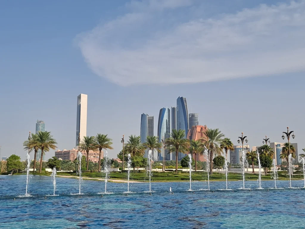 Abu Dhabi towers beyond the fountains in the grounds of Qasr Al Watan