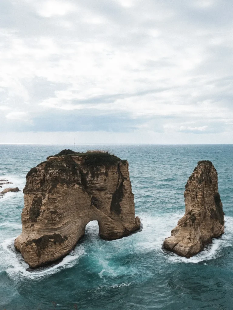 The Pigeon Rocks off Raouche, Beirut, standing in a blue-green sea