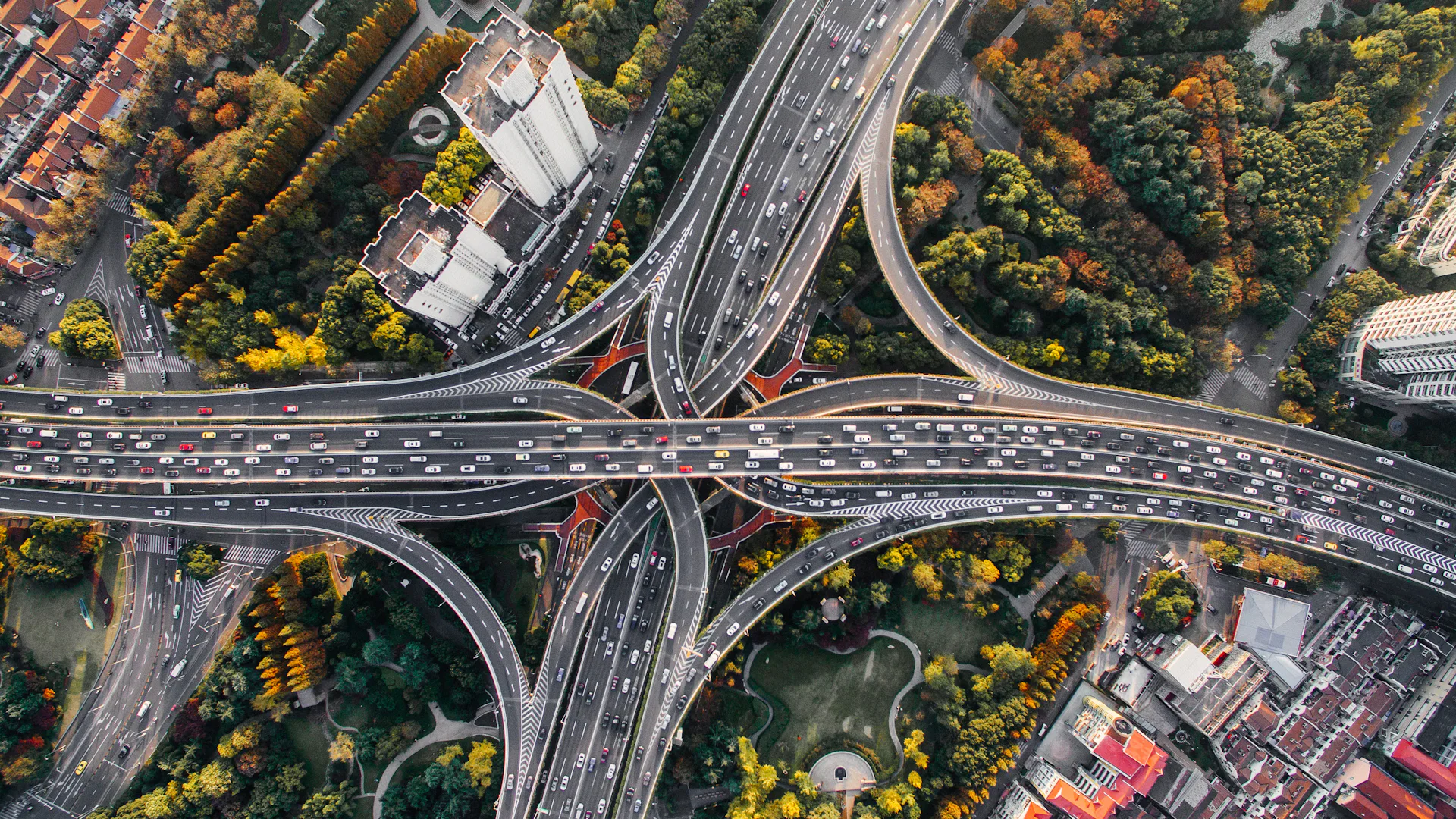 An aerial view of a highway interchange separating and merging traffic
