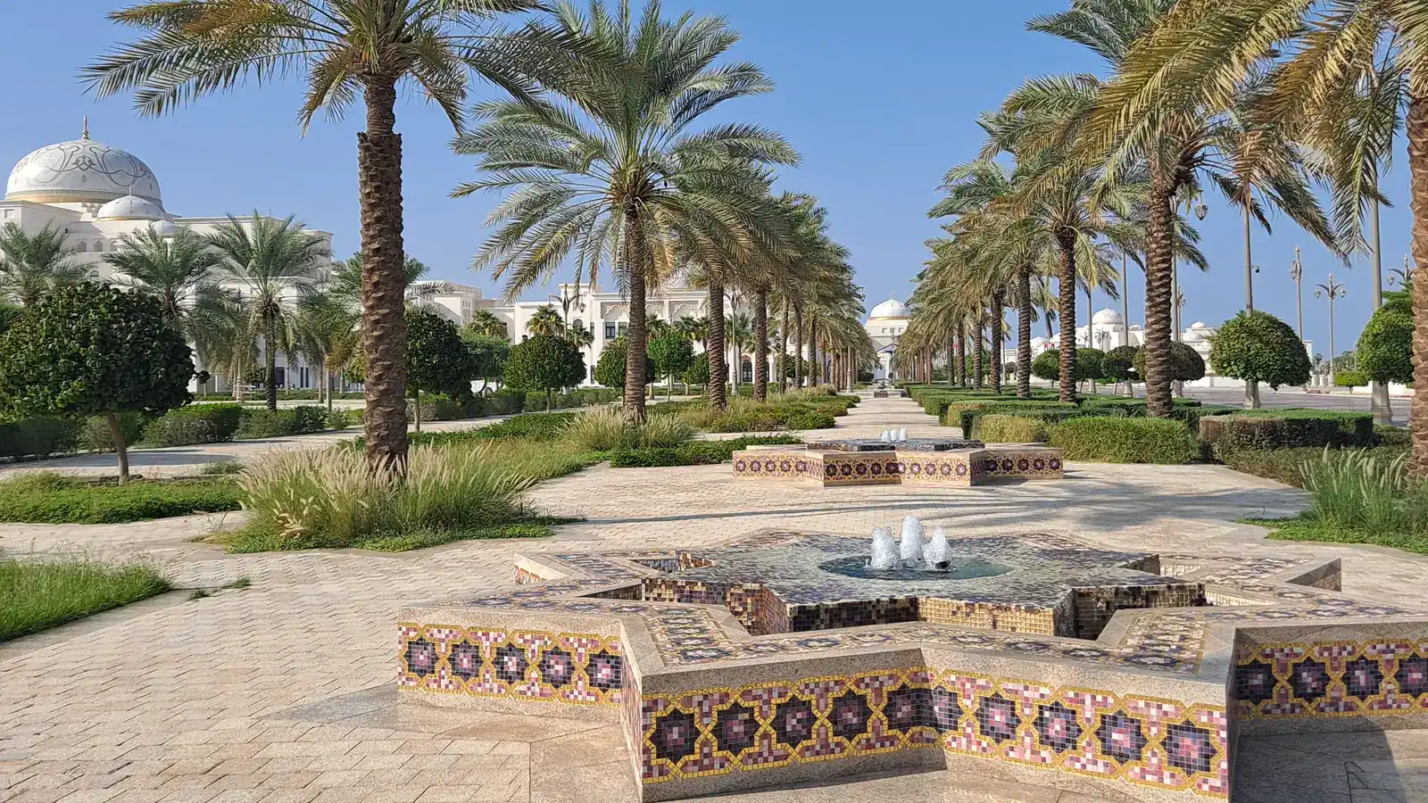 Palm-lined gardens and a tiled fountain in the grounds of Qasr Al Watan, Abu Dhabi