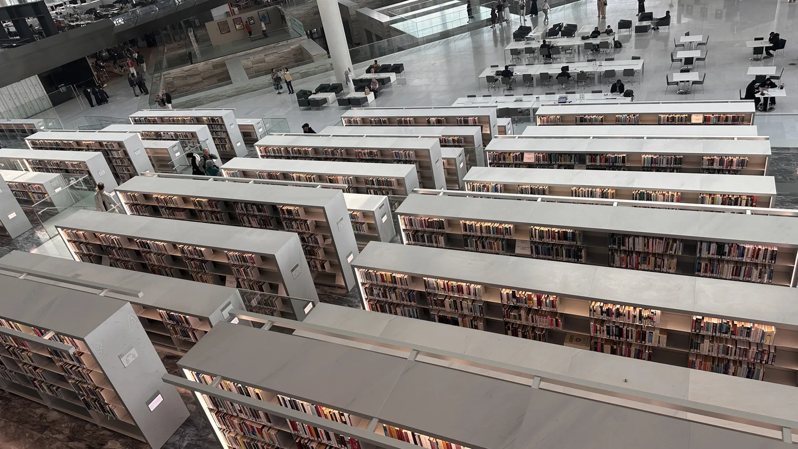 Rows of bookshelves inside the Qatar National Library