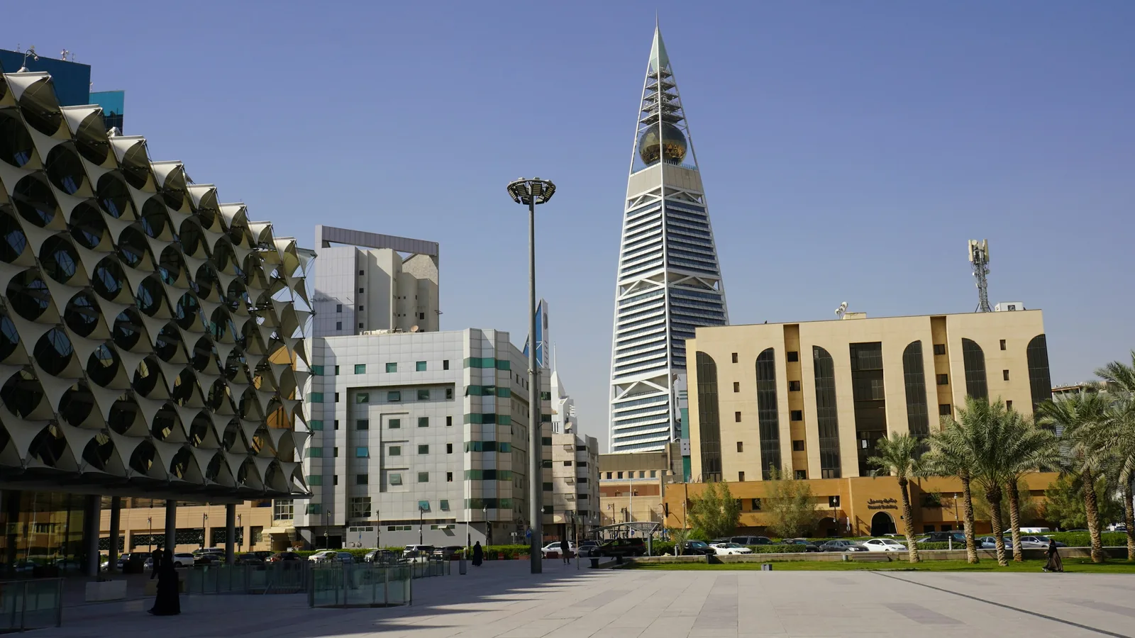 The King Fahad National Library and the Al Faisaliah tower across a plaza in Riyadh